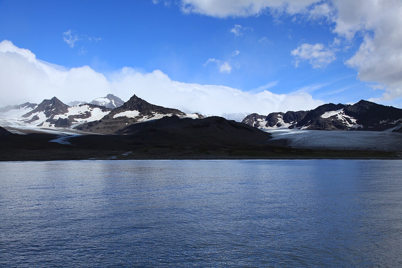 Glaciers and mountains above the water at St. Andrews Bay, South Georgia